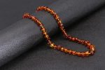 Bracelet en gemmes d'ambre, éclat doré et positif