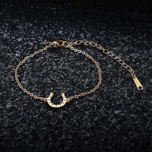 Bijou porte-bonheur en forme de fer à cheval