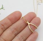 Bijou porte-bonheur, collier os des vœux unique et stylé