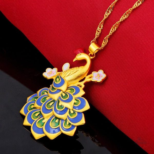 Bijou élégant en forme de plume de paon, symbole de bonheur