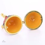 Oeuf de style Fabergé rouge, symbole de chance russe