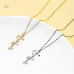 Pendentif porte-bonheur inspiré du bâton d'Asclépios