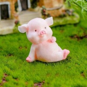 Petite statue cochon, symbole de prospérité